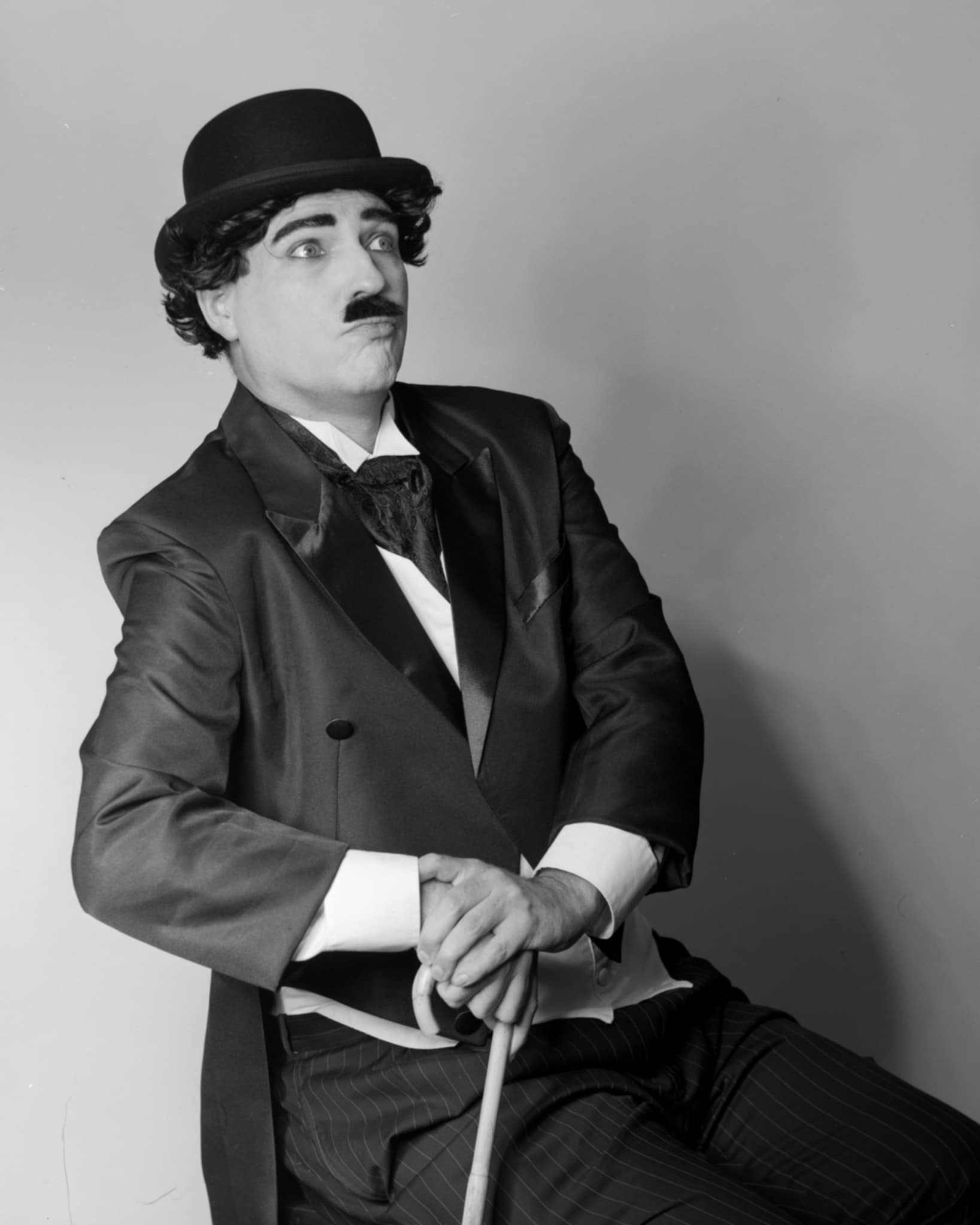 Mark in a bowler hat and moustache, silent-film style